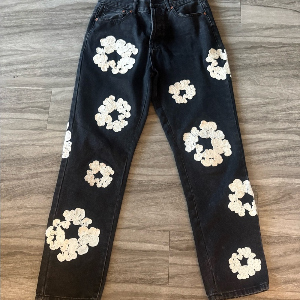 Denim Tears Black Jeans with White Floral Patterns